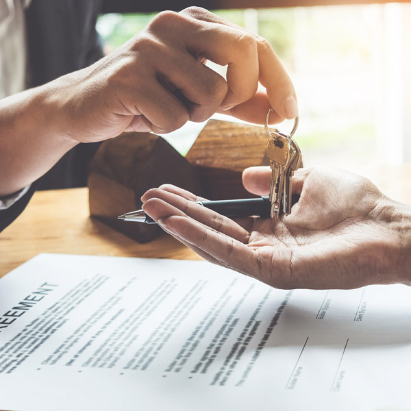 close up of hands accepting keys